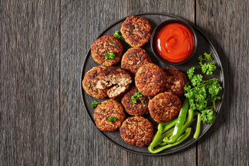 german frikadellen of ground meat on a plate