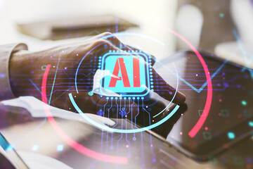Double exposure of creative artificial Intelligence abbreviation and hand working with a digital tablet on background. Future technology and AI concept - obrazy, fototapety, plakaty