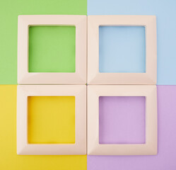 four empty frames on a colorful background