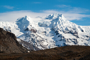 Fototapeta premium Hvannadalshnjúkur, the highest point in whole Iceland, is a peak on the rim of the summit crater of the Öræfajökull volcano and glacier, Vatnajökull National Park