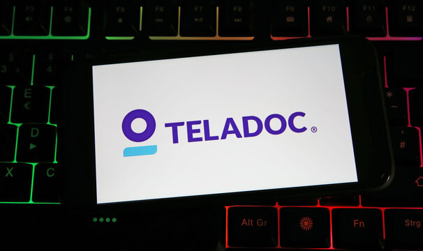 Viersen, Germany - July 9. 2023: Smartphone with logo lettering of Teladoc telemedicine  provider on computer keyboard