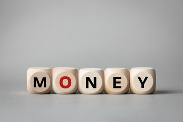 Money symbol, Conceptual word Money on wooden blocks, Financial concept, Beautiful gray background, copy space