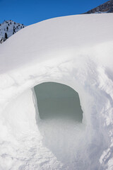 snow igloo in alpine winter landscape