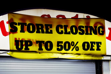 Business along the Boardwalk in Ocean City MD hang a Sale Banner to help sell off inventory before...