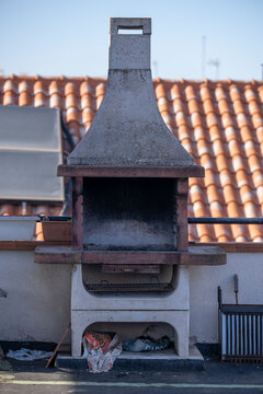 Built-in barbecue, made of clay and cement on a terrace.