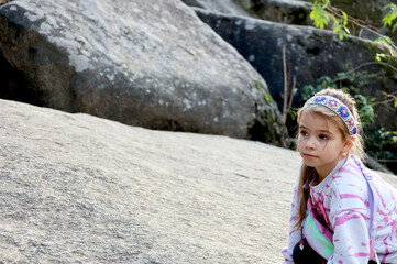 beautiful girl climbing a mountain tourism children's journey