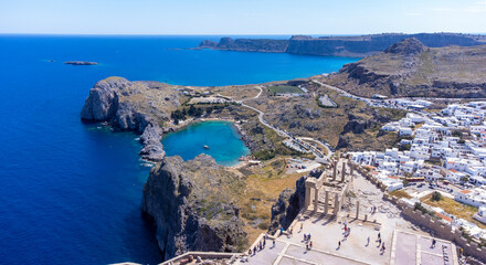 The Acropolis of Lindos in Rhodes island Greece. Saint Paul's Beach and Lindos Acropolis aerial panoramic view.