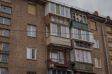 Fototapeta na wymiar Kyiv, Ukraine - November 26, 2023: Balconies are damaged and windows are broken due to the blast wave of a downed drone
