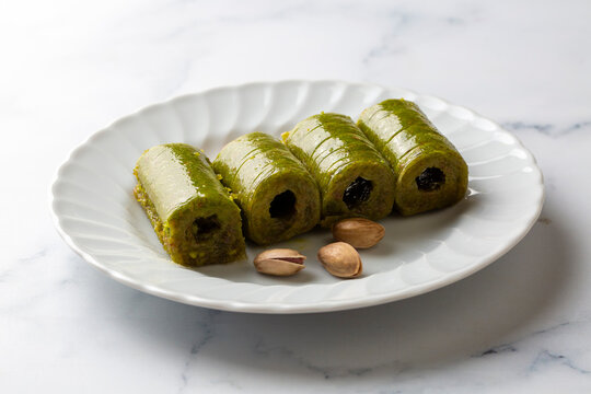 Pistachio baklava. Traditional Middle Eastern Flavors. The local name of Baklava is Fıstıklı Baklava or fıstıklı dolama. Turkish style pistachio baklava presentation and service