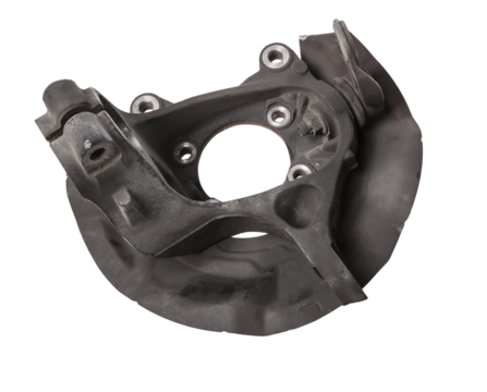 A close-up of a worn metal wheel hub with oil and rust elements on a white background. Seasonal undercarriage repair and replacement of brake system parts in a workshop.