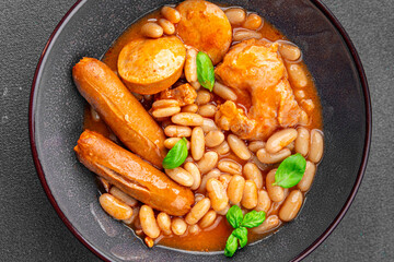 cassoulet bean dish meat, bean, sausage cooking eating appetizer meal food snack on the table copy...