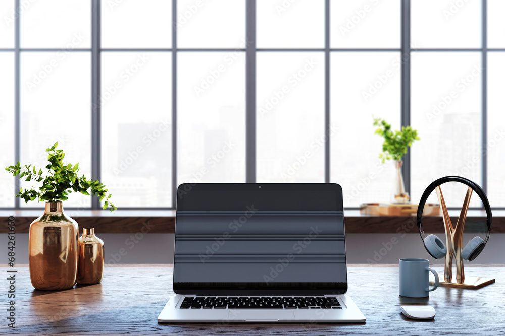 Poster close u of creative designer desk top with laptop, coffee cup, other items and window with city view