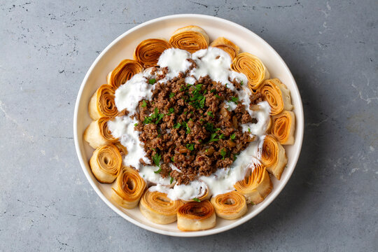 Turkish Manti with Yogurt, Minced Meat and Fried Butter Sauce From Artvin called Silor - Siron - Ziron Rolled Raw Dough and Fried Phyllo -Manlama with Dill