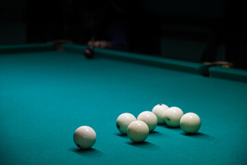 Sports game of billiards on a green cloth