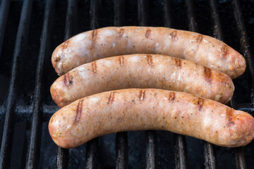 Sausages being barbecued.