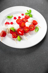Caprese mozzarella tomato appetizer salad skewer finger food eating cooking appetizer meal food snack on the table copy space food background rustic top view