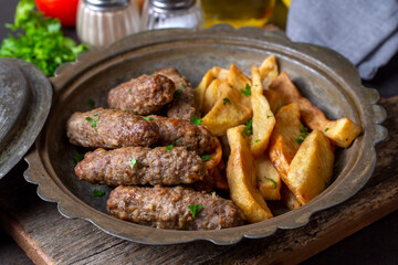 Traditional Turkish food; dry meatballs or inegöl meatballs with potatoes (Turkish name; Kuru kofte or anne koftesi)