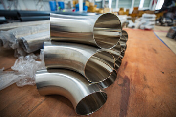 Stainless steel piping elbow component