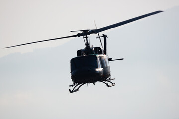 Untitled military helicopter at air base. Air force and army flight transportation. Aviation and rotorcraft. Transport and airlift. Military industry. Fly and flying. - obrazy, fototapety, plakaty