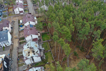 Hostomel, Kyev region Ukraine - 09.04.2022: Top view of the destroyed and burnt houses. Houses were destroyed by rockets or mines from Russian soldiers. Cities of Ukraine after the Russian occupation. - 684268034