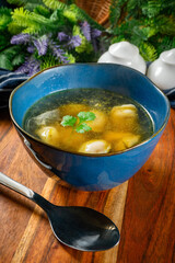 Pelmeni filled with meat served in broth.