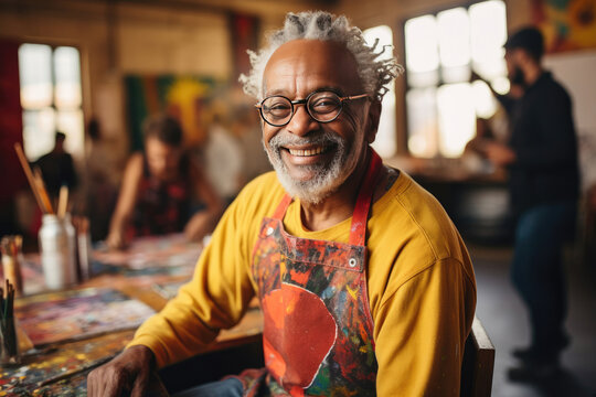 Senior African American artist in studio radiating joy and creativity for potential use in arts education and community engagement advertising