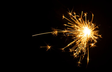 Close-up of sparks from fireworks, decorative lights, and decoration materials for celebrations, festivals, parties, birthdays, Christmas and New Year's celebrations.