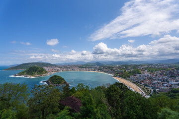 Panoramic view ove the Basque city San Sebastian and the bay of La Concha under a blu sky, Spain