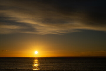 Naklejka na ściany i meble Sunrise and thick cloud over the North Sea