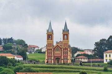Parroquia de San Pedro Ad Vincula in Cóbreces on a cloudy day, Cantabria, Spain