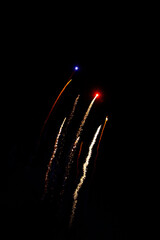 Before fireworks explosions with Golden colors over a party in the black night sky.