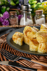 Homemade lazy noodles with cheese, crumbs and melted butter.