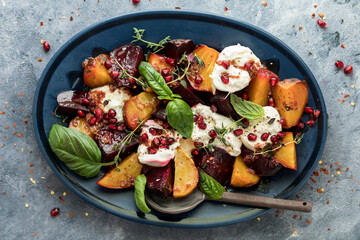 Roasted beets with burrata cheese on a platter, ready for serving. - obrazy, fototapety, plakaty