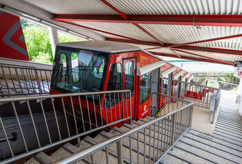 The Archanda funicular (cable car) in bright red color is a public transport that connects the town...