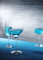 Glasses with blue alcohol cocktail ready for a party