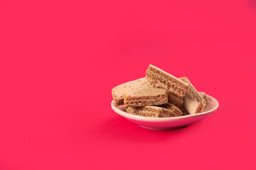 Crumbly cookies on a bright pink background. Place for text