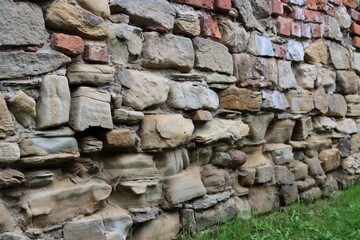 old walls with stones and red bricks about building in Biecz