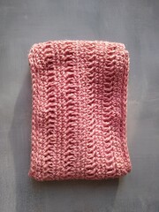 Handbag crocheted jute pink close-up on a gray background