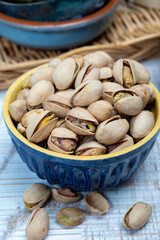 Roasted salty pistachio nuts, tasty healthy vegetarian snack food