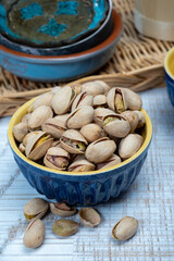 Roasted salty pistachio nuts, tasty healthy vegetarian snack food