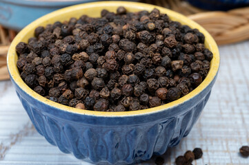 Indian spices collection, dried black peppercorns, kitchen spices