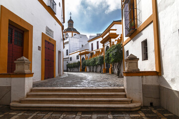 The pretty alleys around the bullring in Seville, Spain. Concept of Andalusian architecture.