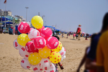 Balloons with love on the beach of Indian Ocean  on a Sunny day at renowned seashore of Puri, Odisha, India,Asia. 12.02.2020.