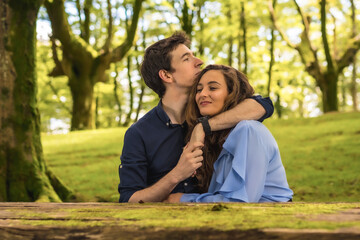 Tender scene of lovers embracing in a forest