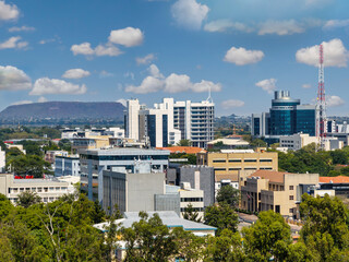 aerial view of Gaborone skyline, cityscape over green area and main mall area, residential and...