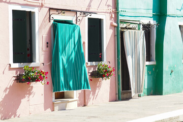 colorful house entrances on the island of burano in italy