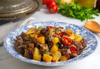 From Turkish cuisine; meat, vegetable kebab, casserole. Turkish name; Maras Tava or Kahramanmaras Tava - Orman Kebabi