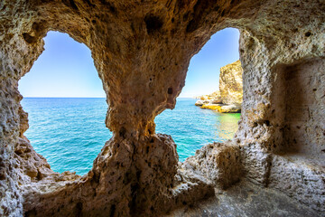 Natural windows - scenic point at the beautiful Algarve, Portugal - 684310455