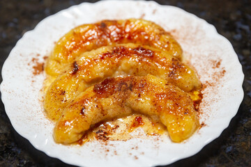 Traditional banana flambéed in butter and cinnamon powder