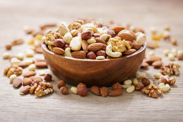 bowl of mixed nuts on wooden table